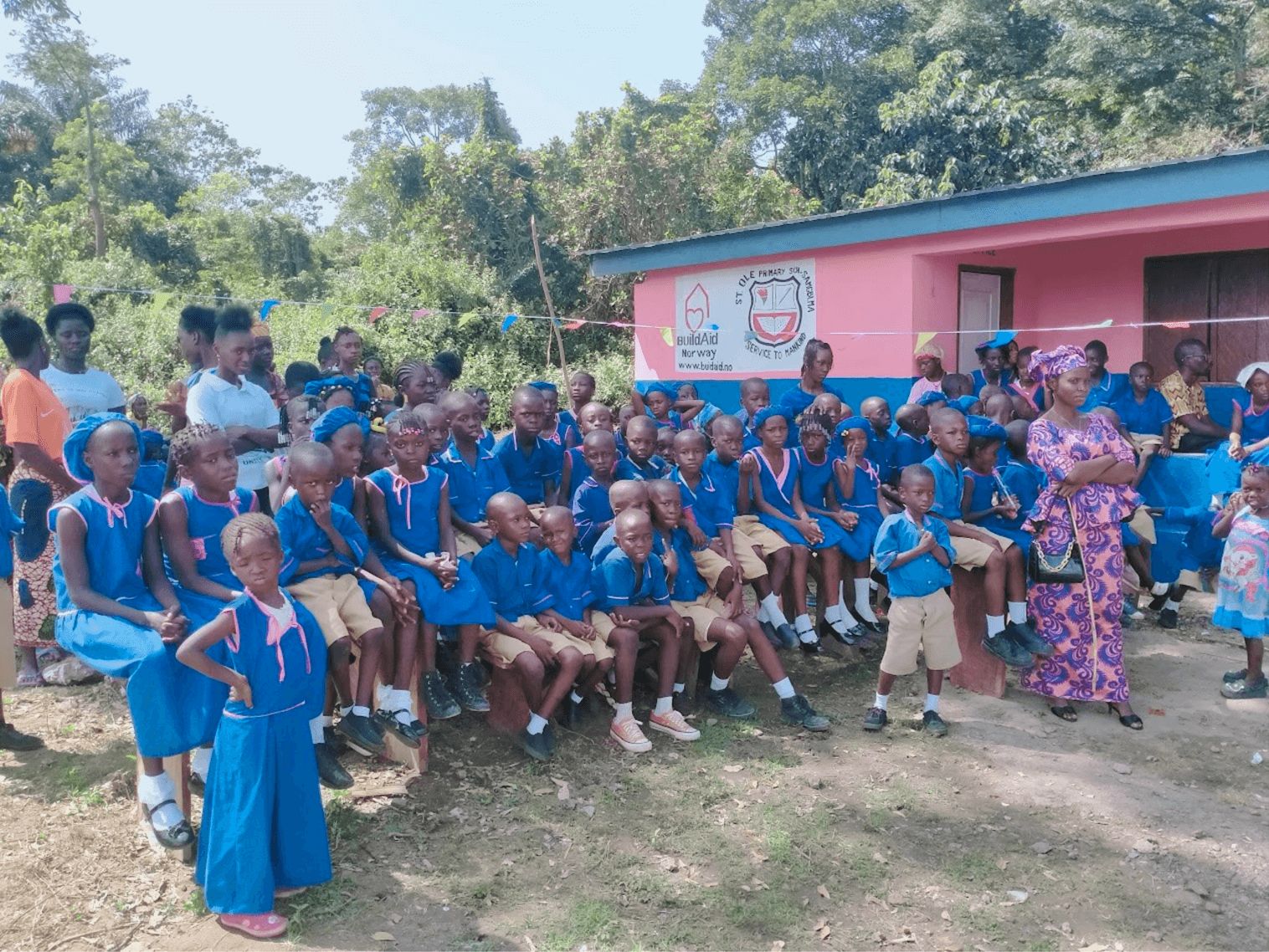 A group of children in blue school uniform